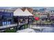 Outdoor dining area in commercial district featuring cocktail lounge, bar, and tents on a rooftop deck at 944 Spencer Ave, Atlanta, GA 30318