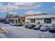 View of a commercial building with multiple store fronts and ample parking spaces at 944 Spencer Ave, Atlanta, GA 30318