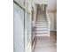 The home's entryway featuring stairs, wood flooring, and a cabinet at 944 Spencer Ave, Atlanta, GA 30318