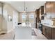 Modern kitchen features a quartz countertop island, stainless appliances, and stylish pendant lighting at 944 Spencer Ave, Atlanta, GA 30318