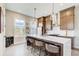 Bright and spacious kitchen featuring a large island with seating, modern appliances, and stylish pendant lights at 944 Spencer Ave, Atlanta, GA 30318