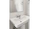Pedestal sink with a mirror and dual towel rings in a half-bathroom at 1106B Wedgewood Nw Dr, Atlanta, GA 30318