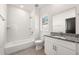 Bathroom features a granite topped vanity, white subway tile shower/tub combo, and brushed nickel fixtures at 1106B Wedgewood Nw Dr, Atlanta, GA 30318