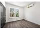 Bright bedroom with wood-look floors, a window, and neutral paint at 1106B Wedgewood Nw Dr, Atlanta, GA 30318