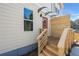 Inviting entrance with wood stairs, modern awning, and a vibrant red door, adding curb appeal to the home at 1106B Wedgewood Nw Dr, Atlanta, GA 30318