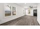 Bright living space with luxury vinyl plank flooring, ceiling fan, and ample natural light at 1106B Wedgewood Nw Dr, Atlanta, GA 30318