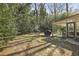 Exterior view of sunroom and the peaceful wooded backyard with partial shade at 3597 Embry Cir, Atlanta, GA 30341