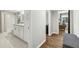 Hall bathroom with updated fixtures, a tiled shower, a granite vanity and wood flooring in the hallway at 3597 Embry Cir, Atlanta, GA 30341