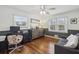 Comfortable office space with a desk, couch, hardwood floors, and natural light at 3597 Embry Cir, Atlanta, GA 30341