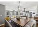Open concept kitchen and dining area with island, stainless steel appliances, and modern lighting at 3597 Embry Cir, Atlanta, GA 30341