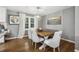 Cozy dining area with a wooden table, cushioned bench, chairs and modern lighting at 3597 Embry Cir, Atlanta, GA 30341