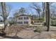 Charming brick home with wood shutters and a well-maintained front yard with mature trees at 3597 Embry Cir, Atlanta, GA 30341