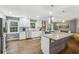 Modern kitchen with white cabinets, stainless steel appliances, and a center island at 3597 Embry Cir, Atlanta, GA 30341