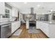 Bright, modern kitchen with white cabinets, stainless steel appliances, and granite countertops at 3597 Embry Cir, Atlanta, GA 30341