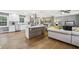 Bright, open-concept living room and kitchen with hardwood floors and stainless steel appliances at 3597 Embry Cir, Atlanta, GA 30341