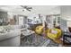 Open concept living area with modern furnishings and hardwood floors adjacent to kitchen at 3597 Embry Cir, Atlanta, GA 30341