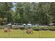 Community pool area with multiple lounge chairs, umbrellas, and play area at 3597 Embry Cir, Atlanta, GA 30341