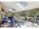 Bright sunroom with ample windows, a ceiling fan, and comfortable seating area at 3597 Embry Cir, Atlanta, GA 30341