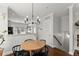 Bright dining area featuring wood table, stylish black chairs, and modern chandelier at 655 Mead Se St # 7, Atlanta, GA 30312