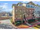 Charming townhouse with brick and siding, manicured landscaping, and inviting entryway at 655 Mead Se St # 7, Atlanta, GA 30312