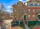 Charming townhouse with brick and siding, manicured landscaping, and inviting entryway at 655 Mead Se St # 7, Atlanta, GA 30312