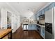 Stylish kitchen with stainless steel appliances, blue cabinets, and hardwood floors at 655 Mead Se St # 7, Atlanta, GA 30312