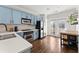 Bright kitchen boasts blue cabinets, quartz counters, and stainless steel appliances at 655 Mead Se St # 7, Atlanta, GA 30312