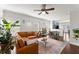 Inviting living room features a leather sofa, area rug, and an abundance of natural light at 655 Mead Se St # 7, Atlanta, GA 30312