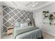 Main bedroom features stylish accent wall, tray ceiling, neutral decor, and natural lighting at 655 Mead Se St # 7, Atlanta, GA 30312