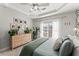 Cozy main bedroom with neutral decor, tray ceiling, and bright natural light at 655 Mead Se St # 7, Atlanta, GA 30312