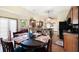 Inviting dining area with a round wooden table and oak cabinetry at 6797 Yorkdale Ct, Lithonia, GA 30058