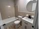 The bathroom features an updated vanity with black hardware and a shower-tub combination at 951 Bingham Ln, Stone Mountain, GA 30083