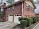 A lovely two-story brick home, featuring a two-car garage and well-maintained landscaping at 951 Bingham Ln, Stone Mountain, GA 30083