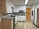 Bright kitchen featuring white cabinetry, granite countertops, and stainless steel appliances at 951 Bingham Ln, Stone Mountain, GA 30083