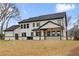 Lush backyard view highlighting the covered patio area and well-manicured lawn at 1629 Phillips Rd, Lithonia, GA 30058