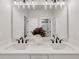 Bathroom featuring a modern double vanity with black faucets at 1629 Phillips Rd, Lithonia, GA 30058