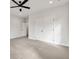 Spacious bedroom featuring three windows and a ceiling fan at 1629 Phillips Rd, Lithonia, GA 30058