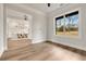 Bright room showcasing dining area through wide doorway; crown molding details at 1629 Phillips Rd, Lithonia, GA 30058