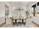 Bright dining room with neutral decor, modern chandelier, and large window with outside view at 1629 Phillips Rd, Lithonia, GA 30058