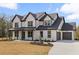 Charming home with a neatly landscaped lawn, a two-car garage, and a paved driveway at 1629 Phillips Rd, Lithonia, GA 30058