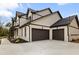 A luxurious home with a painted brick facade, two-car garage, and beautifully landscaped yard at 1629 Phillips Rd, Lithonia, GA 30058