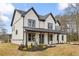 Inviting front exterior showcases the home's charming design and landscaped front yard at 1629 Phillips Rd, Lithonia, GA 30058
