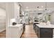 Modern kitchen featuring an island with bar seating and a seamless transition to the living area at 1629 Phillips Rd, Lithonia, GA 30058