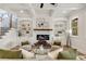 Inviting living room featuring a fireplace, built-in bookshelves, and coffered ceilings at 1629 Phillips Rd, Lithonia, GA 30058