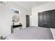 Inviting bedroom with a modern closet, console table, and ample natural light at 2668 Brown Nw St, Atlanta, GA 30318