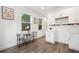 Cozy kitchen dining area with a small table, two chairs, and natural light streaming through the windows at 2668 Brown Nw St, Atlanta, GA 30318