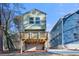 Modern home with a covered ground level and elevated outdoor wooden deck for relaxing and entertaining at 2668 Brown Nw St, Atlanta, GA 30318