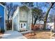 Charming two-story home with a modern design and well-maintained front yard and a long driveway at 2668 Brown Nw St, Atlanta, GA 30318