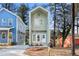 Charming two-story home with a modern design and well-maintained front yard, next to a blue home at 2668 Brown Nw St, Atlanta, GA 30318