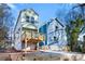 New construction home featuring a covered area, an elevated deck, and a long concrete driveway at 2668 Brown Nw St, Atlanta, GA 30318